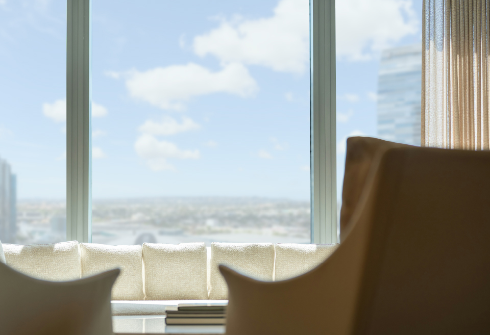 two chairs facing a window with city view